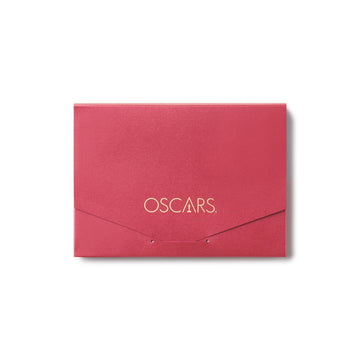 A red envelope with the Oscars gold logo monogram embossed on it.